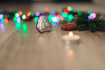 Close-up of illuminated christmas lights on table