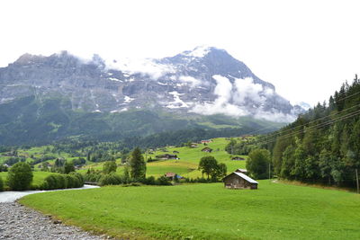 Scenic view of landscape and mountains against sky