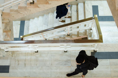 Low section of woman hanging on steps