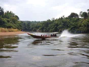 Scenic view of boat in sea against sky