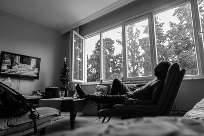 Man resting on sofa at home