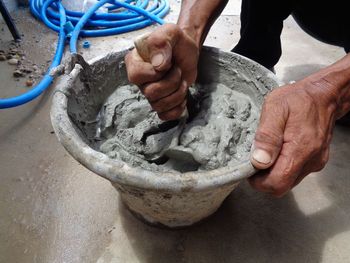 Close-up of man working in kitchen