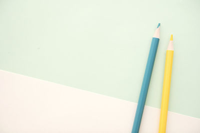 Close-up of colored pencils against white background