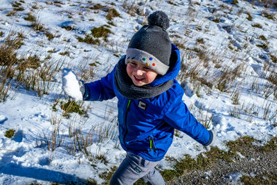 Portrait of cute boy in snow