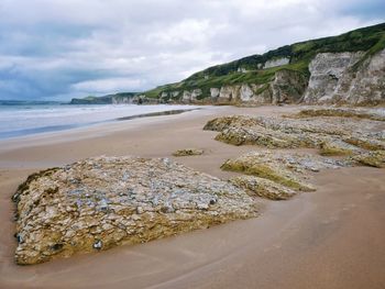 Scenic view of beach against sky