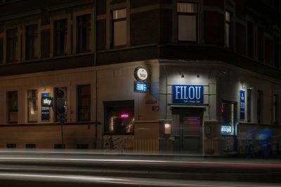 Illuminated buildings in city at night