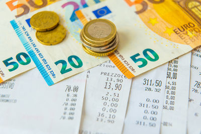 High angle view of coins on table
