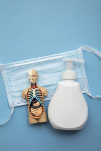 Close-up of dentures against blue background