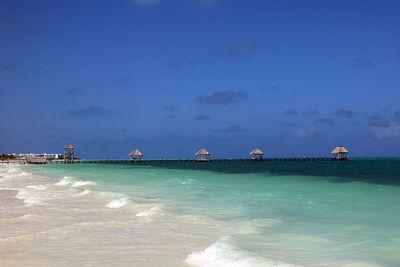 Scenic view of sea against blue sky