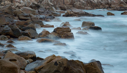 Scenic view of rocks in sea