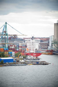 View of city by sea against sky