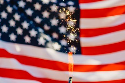 Full frame shot of american flag with sparkler