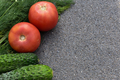 Close-up of vegetables and herb on table