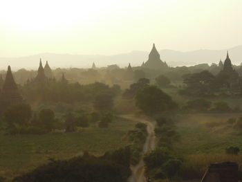 Panoramic view of temple against buildings