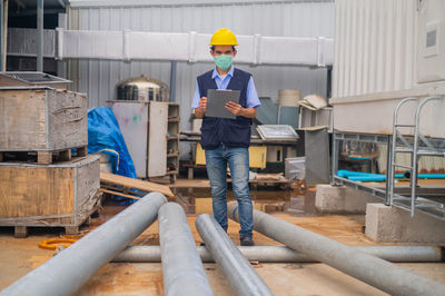 Rear view of man working at construction site