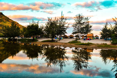 Scenic view of lake against sky at sunset