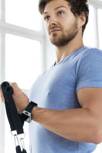 Side view of man exercising in gym