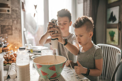 Mother and daughter on table