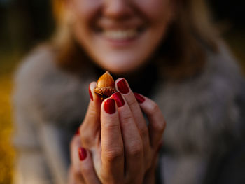 Acorn nut in female hands