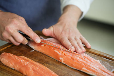 Midsection of man preparing food