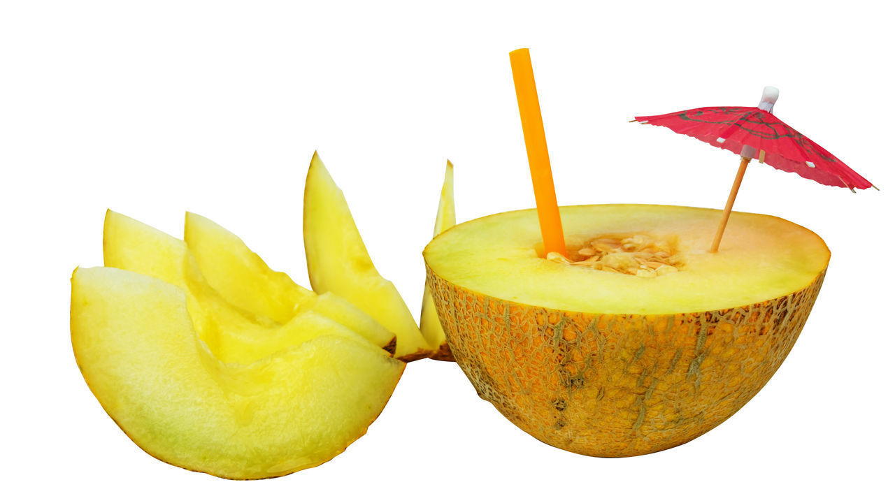 CLOSE-UP OF LEMON AGAINST WHITE BACKGROUND