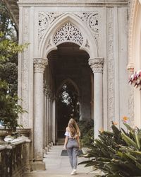 Rear view of woman standing in historic building in sintra