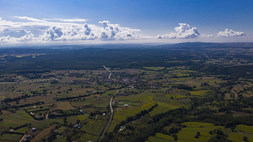 Aerial view of agricultural field against sky