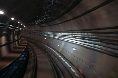 Blurred motion of illuminated railroad tracks at night