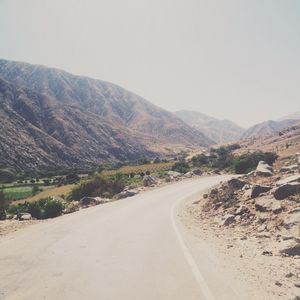 Road on mountain against clear sky