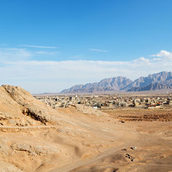 Scenic view of arid landscape against sky