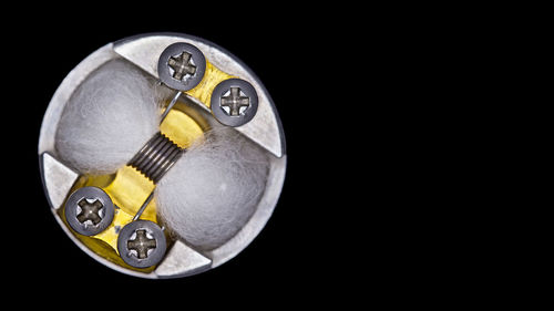 High angle view of coins on black background