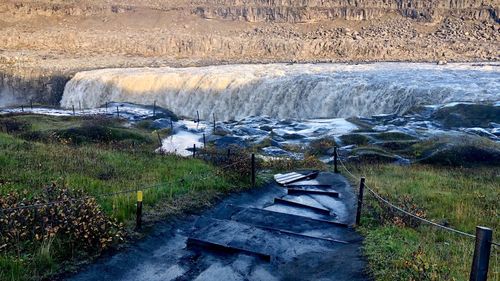 High angle view of water flowing through rocks