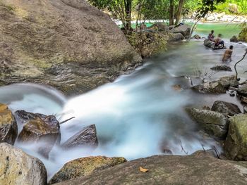 Long exposure shot of scenic view of waterfall in forest