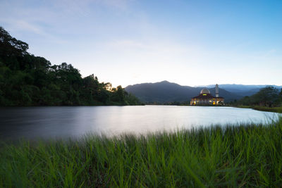 Beautiful view of darul quran mosque with reflections during sunrise in selangor, malaysia.