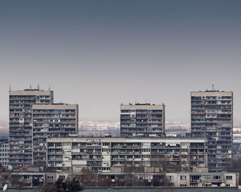 Buildings in city against sky