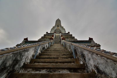 Low angle view of empty steps at wat arun against sky