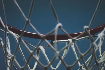 Close-up of basketball hoop against sky