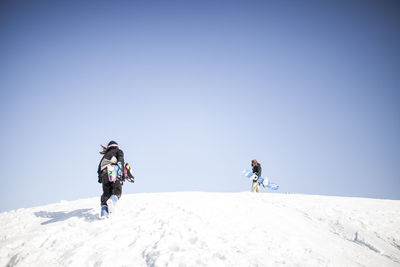 Two young guys out snowboarding together