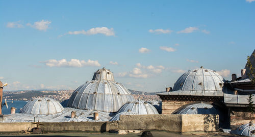 Panoramic view of tent on roof of building against sky