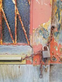 Close-up of padlocks on metal door