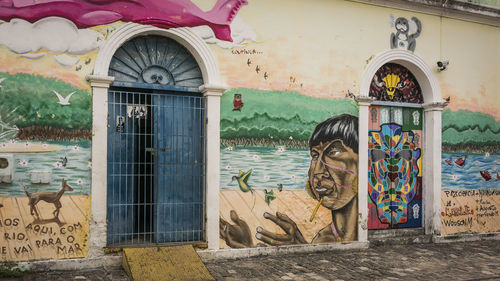 Mural on house wall in city