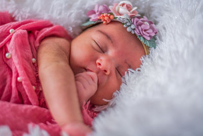 Portrait of cute baby girl with flower crown