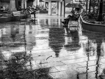 Reflection of city on wet street during monsoon