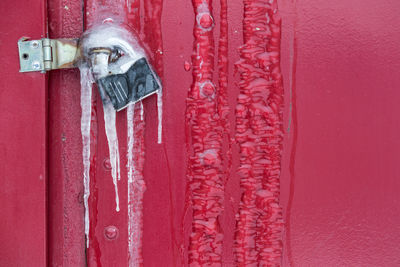Close-up of frozen padlock on closed door