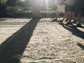 Low section of man shadow on floor