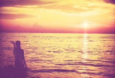 Scenic view of sea at sunset