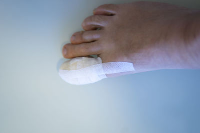 Close-up of man hand over white background