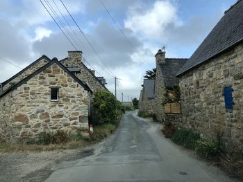 Street amidst buildings against sky