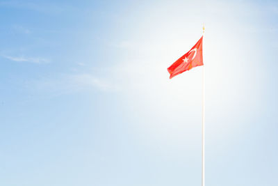 Low angle view of flag against sky