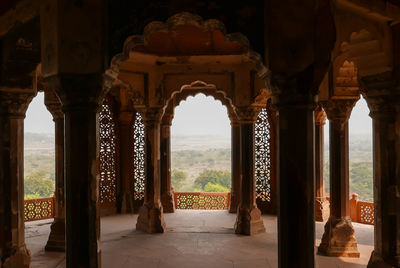 Buildings seen through arch window